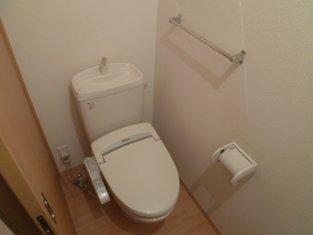 Toilet. The same is by Property of the room