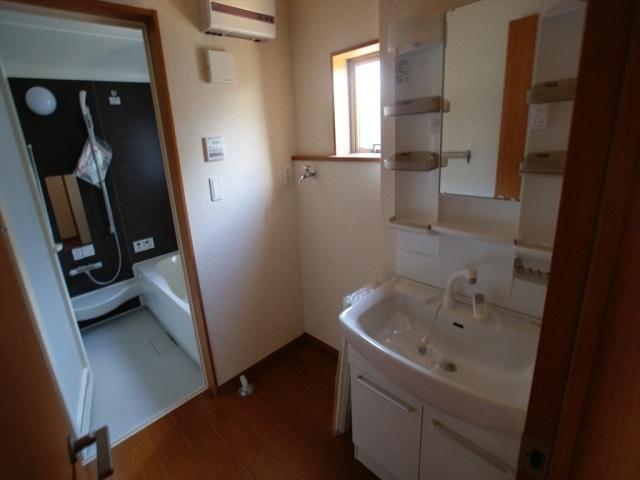 Wash basin, toilet. Vanity with happy shower in the morning