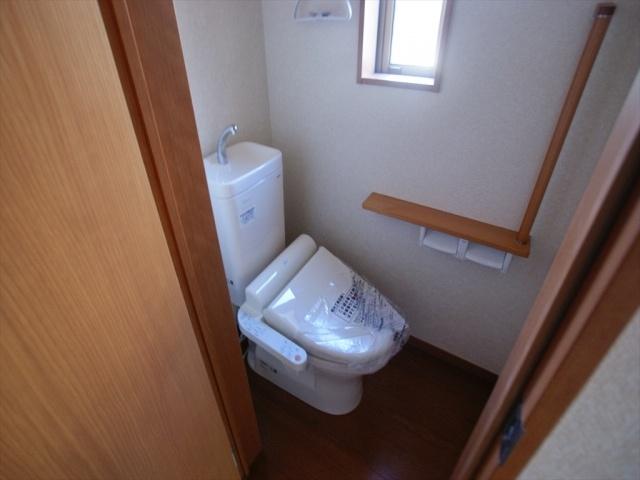 Toilet. Toilet is equipped with shower