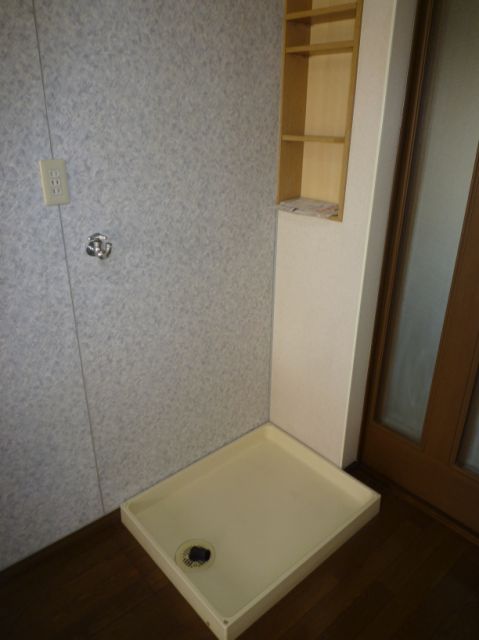 Other room space. It is conveniently located a small shelf in the Laundry Area.