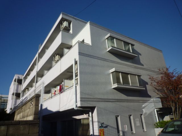 Building appearance. White day is a good apartment. 