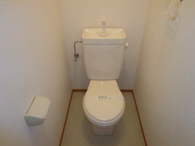 Toilet. The photograph is on the second floor of the room.