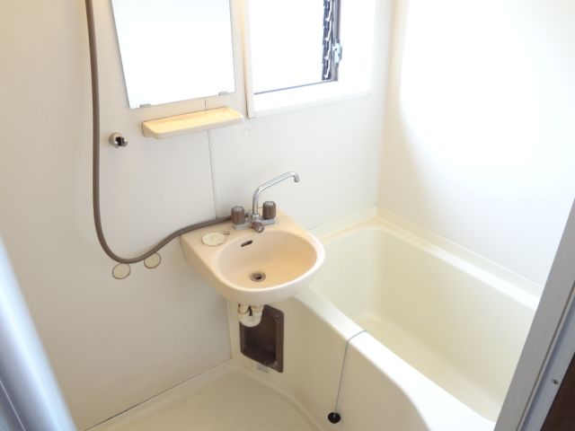 Bath. Bathroom with wash basin. Also with window