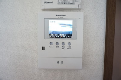 Other Equipment. Glance at a TV monitor with intercom visitor who is found