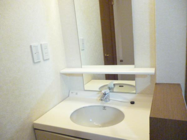 Wash basin, toilet. Second floor bathroom vanity cleaning settled