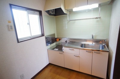 Kitchen. There is a window is bright kitchen