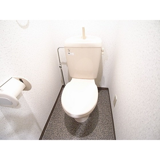 Toilet. It is a photograph of the other in Room. 