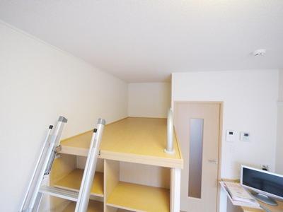 Other room space. Loft-style high bed