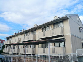 Building appearance. Balcony side parking spaces