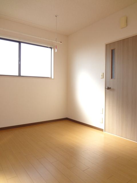 Living and room. It is bright because the bright color of the flooring