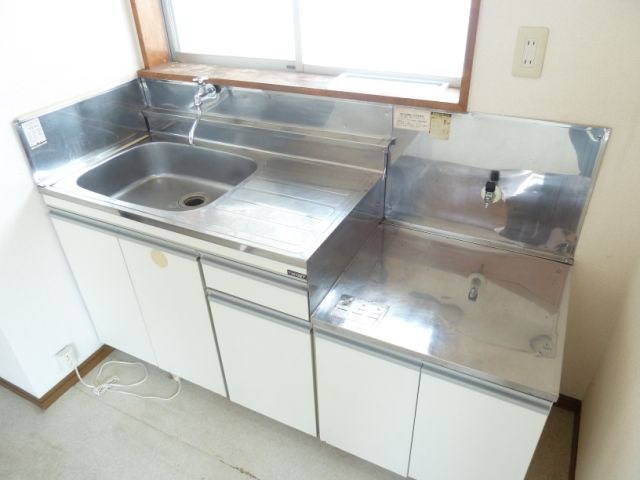 Kitchen. Two-burner gas stove is put kitchen.