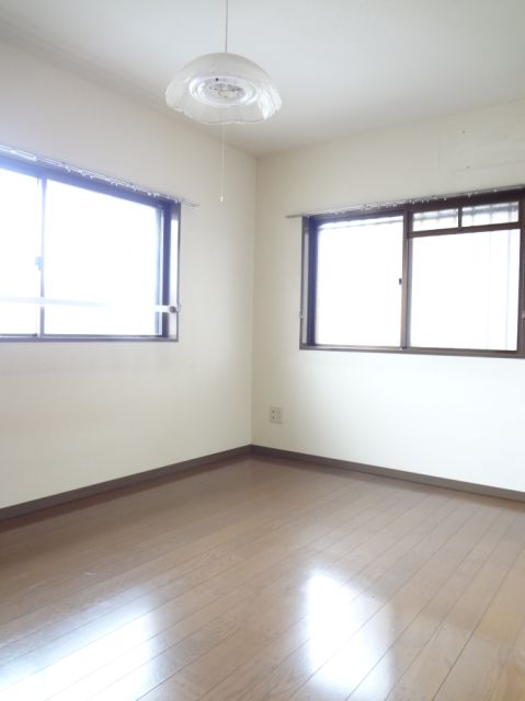 Living and room. It is bright and there is a two-way window