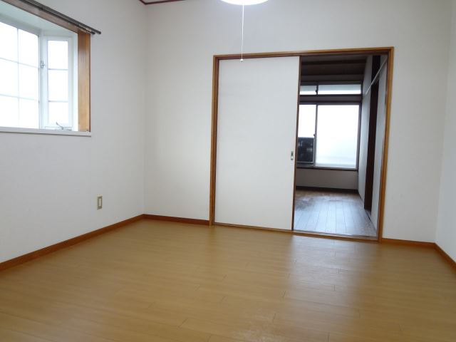 Living and room. It is a bright living room there is a large bay window.