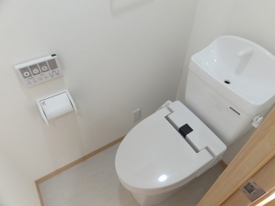 Toilet. With warm water washing toilet seat!