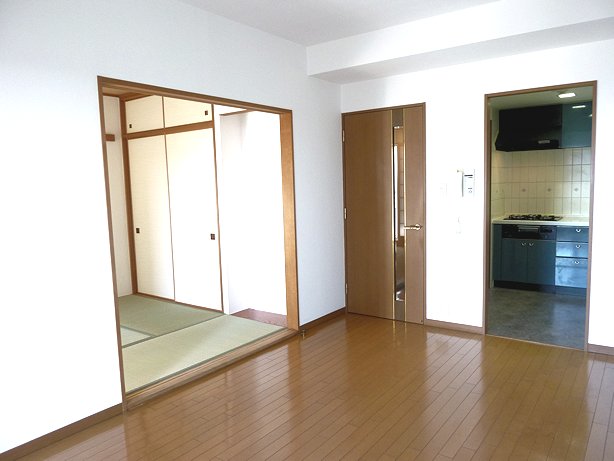 Living and room. Furthermore spacious living room and open the sliding door of a Japanese-style room