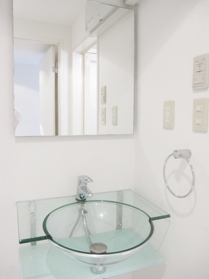 Washroom. Transparent stylish wash basin