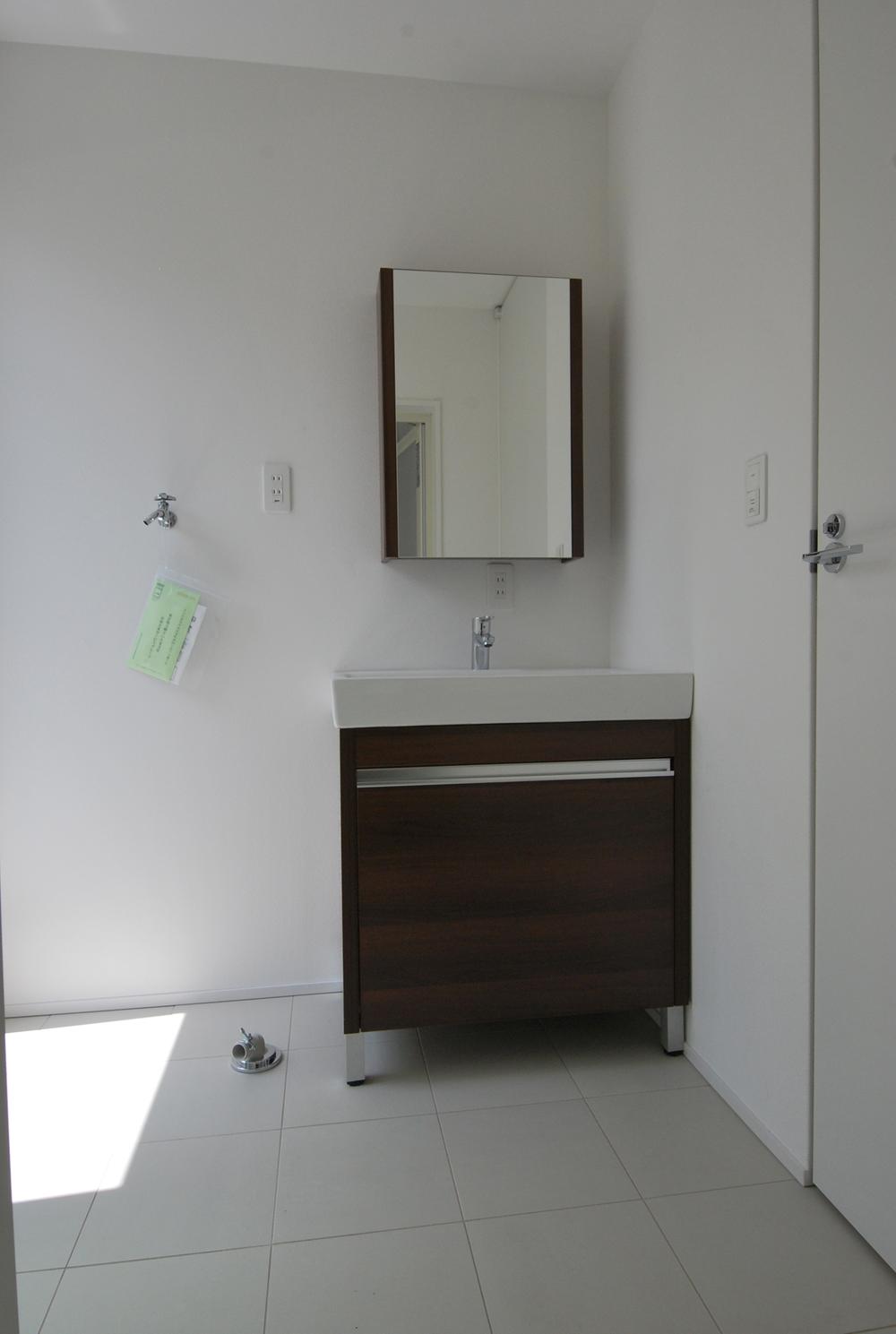Wash basin, toilet. Bright wash undressing room incorporating light. Stylish wash basin is also one of the features. 