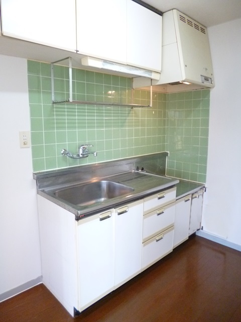 Kitchen. There is an upper cupboard large storage capacity