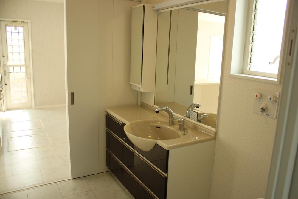 Wash basin, toilet. Vanity (wash room is about 1.25 square meters