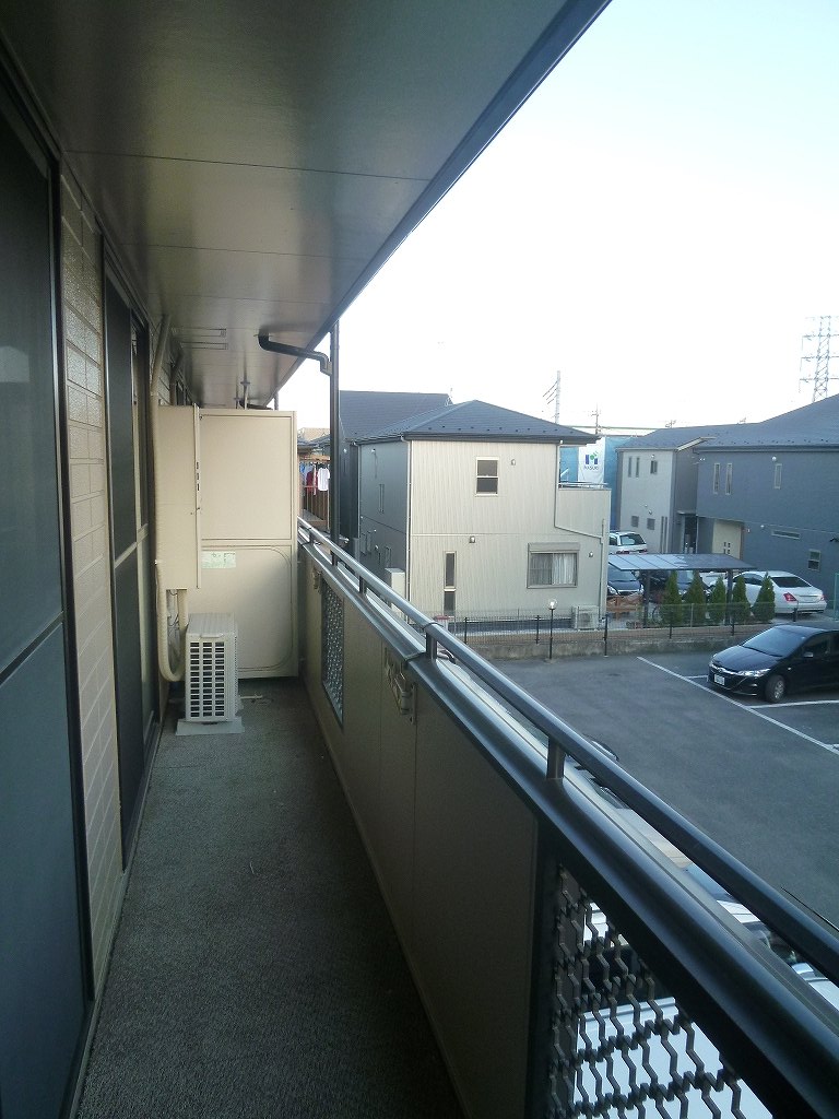 Balcony. It is a photograph of another room of the same properties