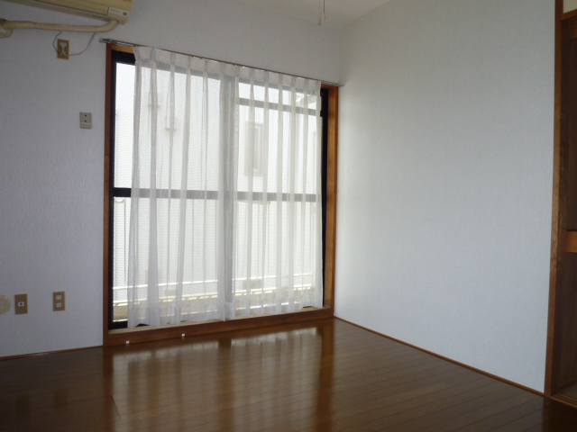 Living and room. It is a photograph of the same type of room