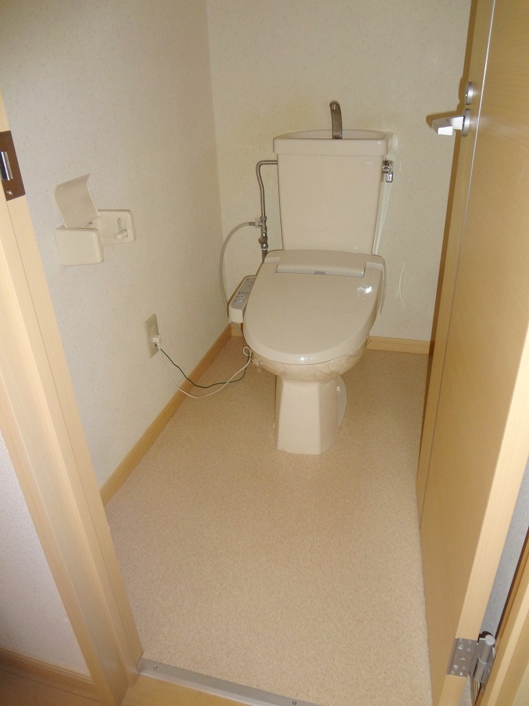 Toilet. The same is by Property of the room