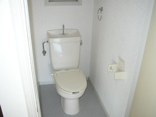 Toilet. The same is by Property of the room