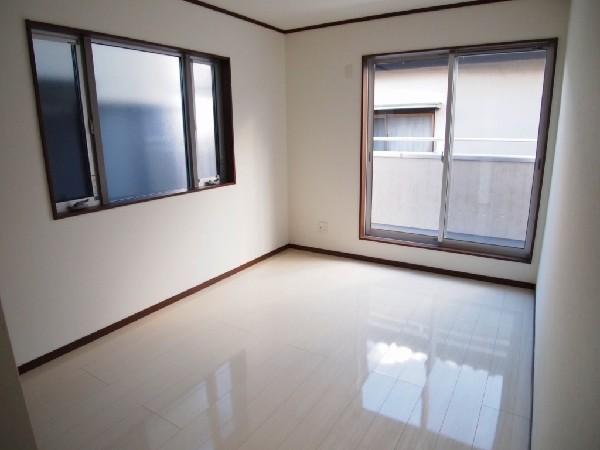Non-living room. Brown door shine well in bright colors of flooring. 