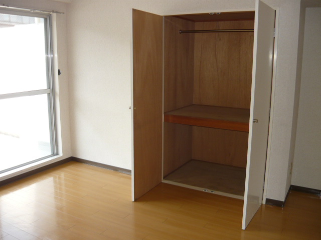 Washroom. Storage of LDK. Convenient clothes storage with a hanger pipe
