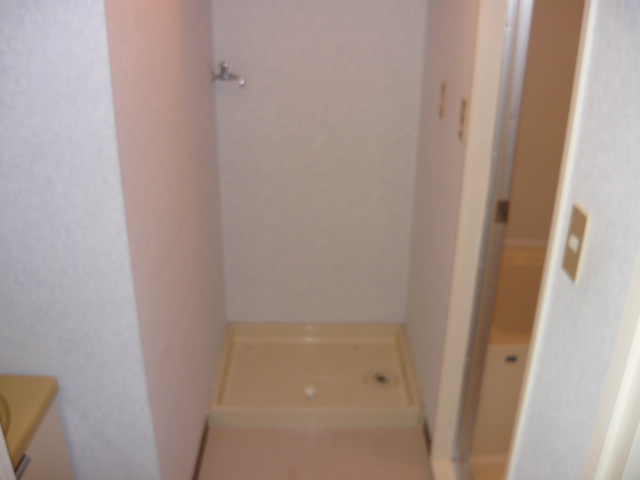 Other room space. Washing machine in the room with a waterproof bread