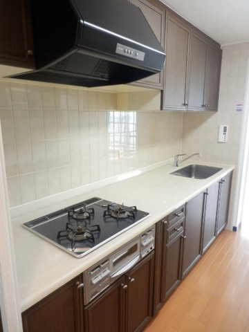 Kitchen. There is a cupboard in the rear.