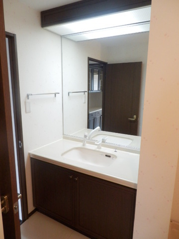 Washroom. There is housed on the right side of the wall.