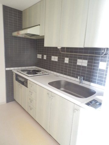 Kitchen. It is an electric stove in the kitchen.