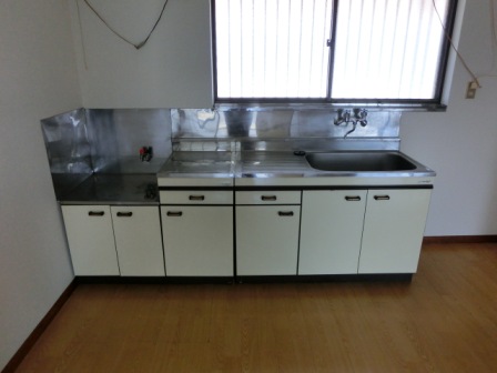 Kitchen. Kitchen there is a large window. There is also a spacious work space