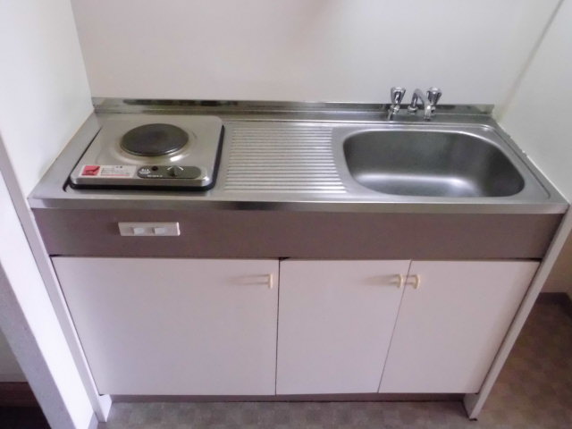 Kitchen. 1-neck is electric stove mini-kitchen with.