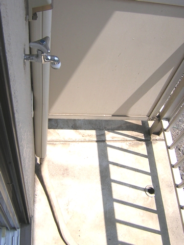 Balcony. Washing machine storage is veranda