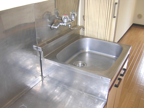Kitchen. Gas stove installed Friendly Kitchen. Sink also is spread