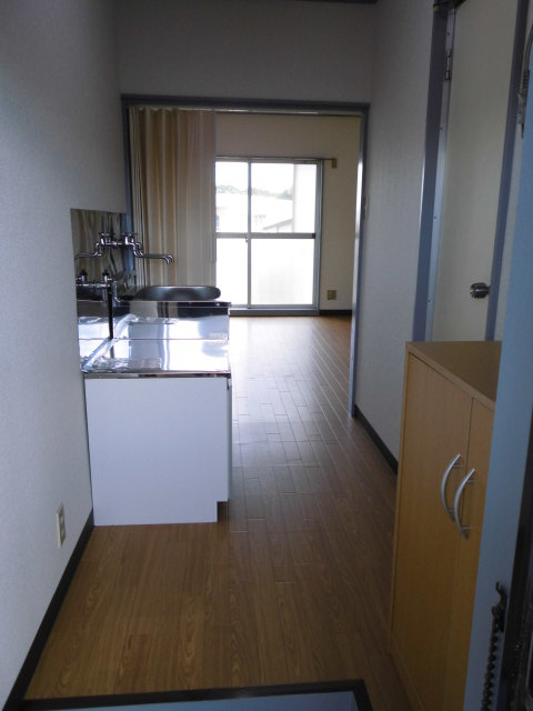Living and room. Kitchen space. There is also a refrigerator space