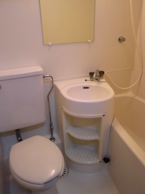 Bath. 3-point unit bus. Basin under is small storeroom field