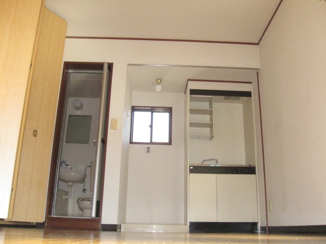 Living and room. There is an electrical outlet in the kitchen immediately side.