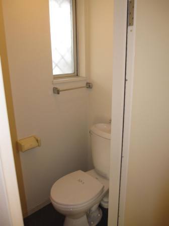 Toilet. Toilet with a small window is a ventilation if easier bright.