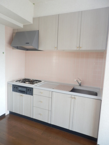 Kitchen. It is a gas stove with a kitchen.