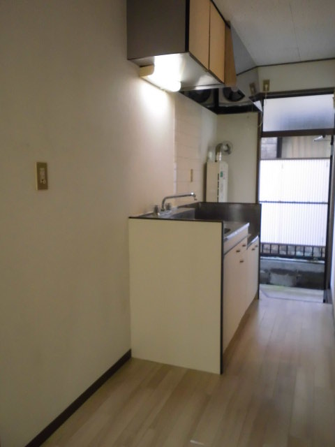 Living and room. There is space put the refrigerator and oven in the kitchen next to
