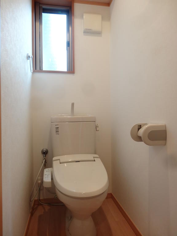 Toilet. Bidet with toilet. There is a window for each corner room.