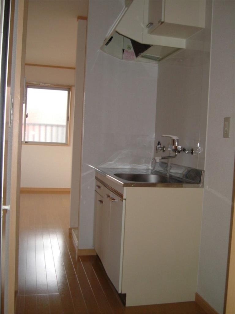 Living and room. There is a kitchen space in the hallway