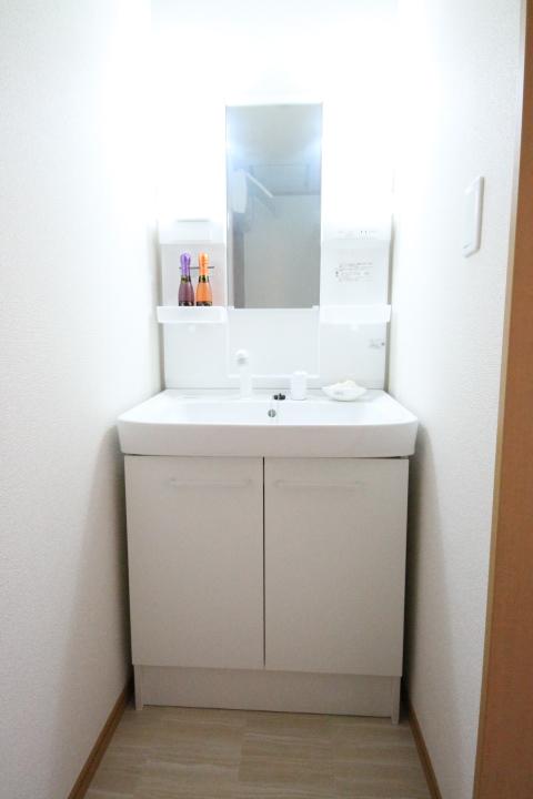 Wash basin, toilet. E Building. Vanity of shampoo dresser type. 