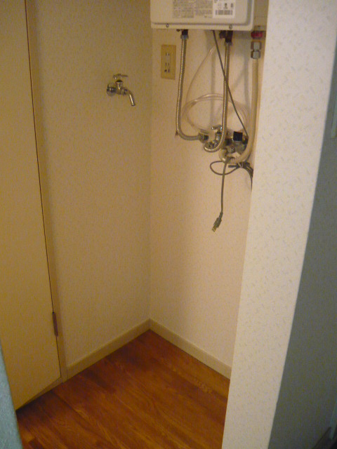Washroom. There is a washing machine storage room.