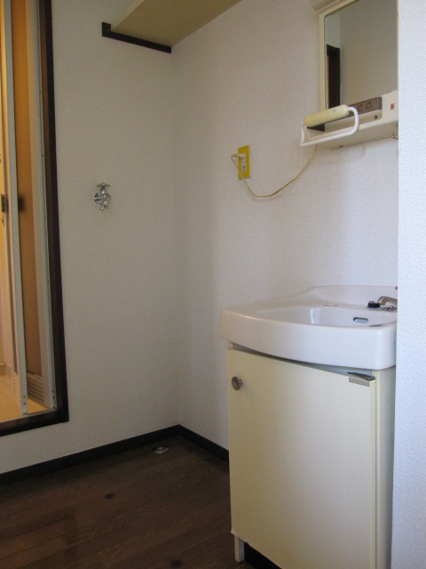 Other room space. There is storage independent sink and washing machine inside the room