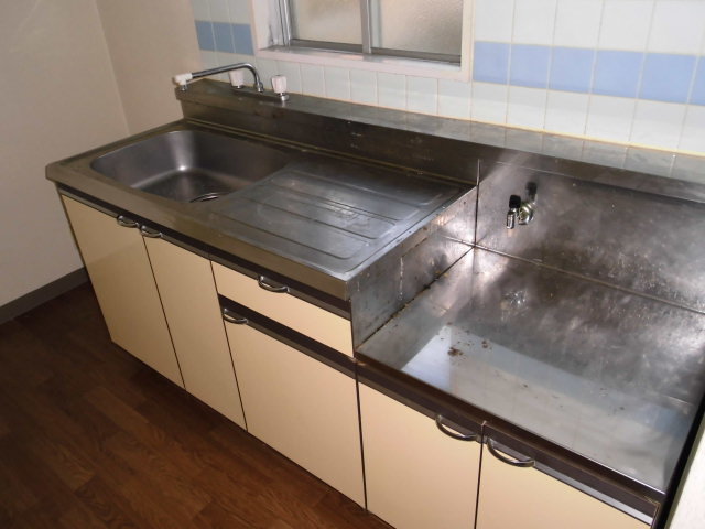 Kitchen. Gas stove installation-friendly kitchen with a small window