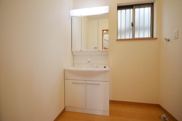 Wash basin, toilet. Vanity with a three-sided mirror Shampoo dresser